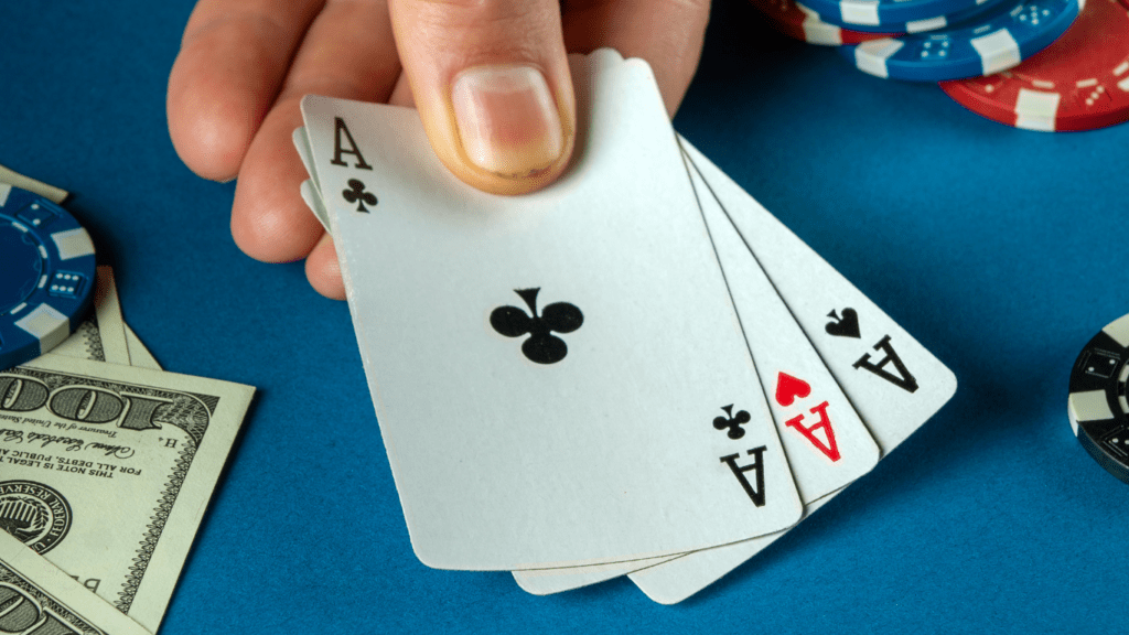 Holding playing cards and casino chips 